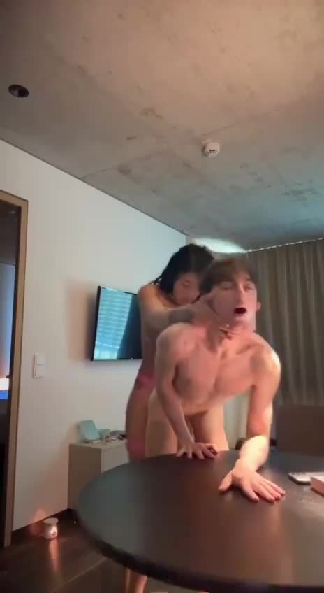 Asian trans bends twink over table and fucks him ANYBODY KNOW HER NAME?